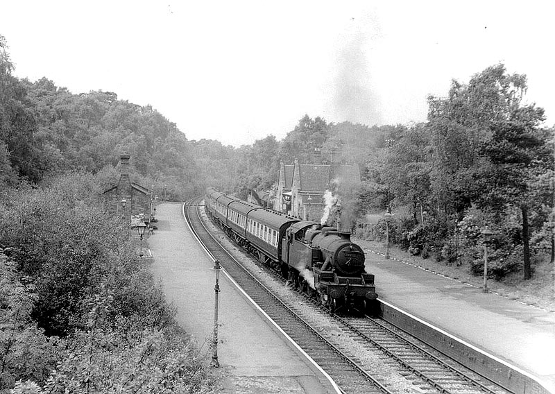 Ex-LMS 4MT 2-6-4T No 42482 at the head of a down six-coach passenger service passes through Streetly at sometime in 1953