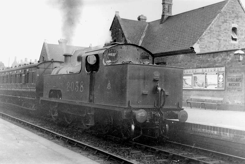 Ex-Midland Railway 0-6-4T No 2038 is seen running bunker first on a New Street to Walsall service circa 1924