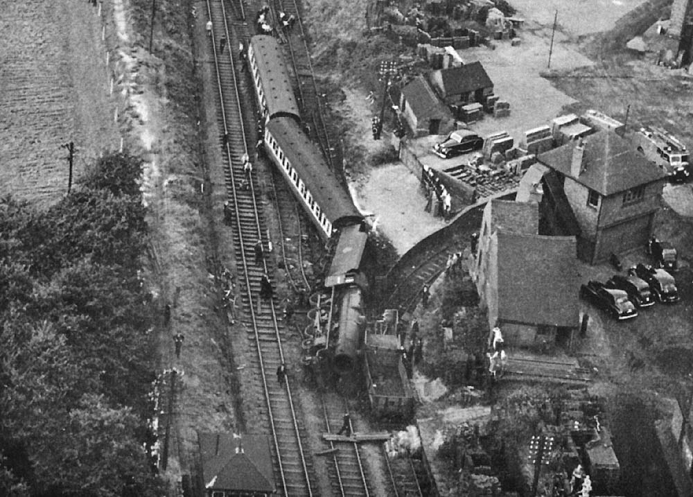 Close up showing the severely damaged railway track and the locomotive No 45699 'Galatea' lying on its side