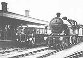 The Ro-Railer is standing at the up platform whilst ex-MR 4-4-0 No 556 stands on the middle road