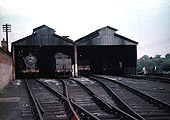 Ex-LMS 0-6-0 4F No 44587 is standing inside the shed in company with other classmates on 21st May 1956