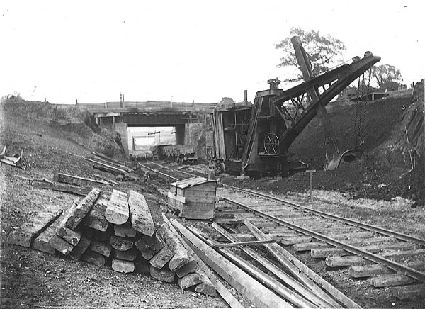 View of a steam powered excavator being employed in a cutting south of Clifton Road bridge in Rugby