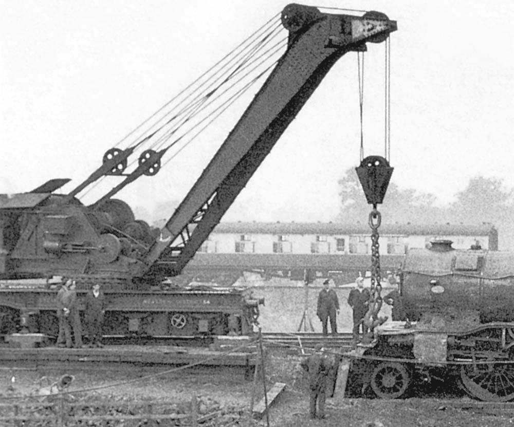 Close up showing the larger of the two rail cranes set up with jacks and timbers after re-righting the locomotive