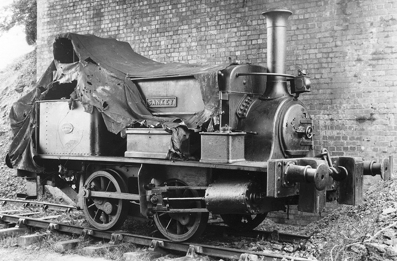 EHLR 0-4-0ST 'Sankey' is protected from the elements both by a tarpaulin as well as standing under the bridge