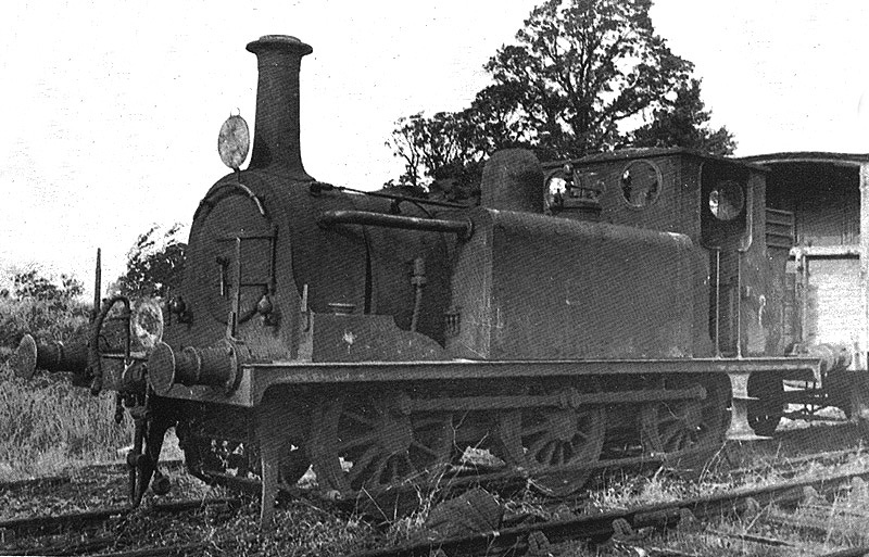 View of EHLR 0-6-0T No 2 ex-LBSCR No 674 'Shadwell' standing in front of the EHLR guards van circa 1930