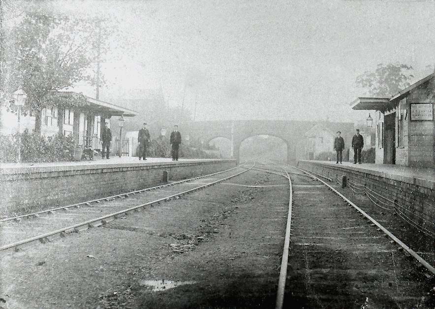 Looking towards Birmingham along the up line with Acocks Green's main station building on the left and the up platform waiting room on the right