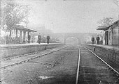 Looking towards Birmingham along the up line with Acocks Green's main station building on the left and the up platform waiting room on the right