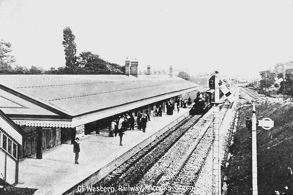 Looking towards Leamington as a local passenger service from Leamington arrives at the down relief platform with the down loop line on its right
