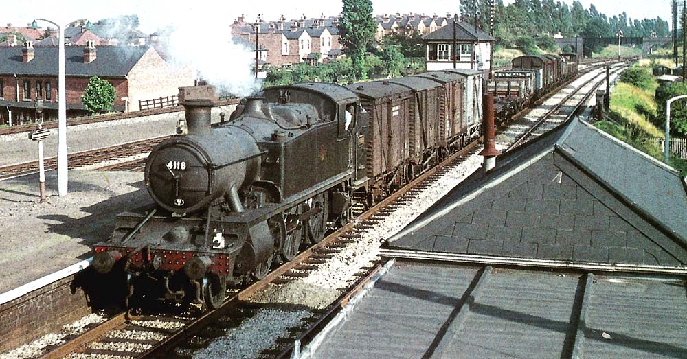 Ex-GWR 5101 class 2-6-2T No 4118, in unlined black livery, hauls a class F(7) freight past Acocks Green Signal Box on the down relief line on 29th August 1961