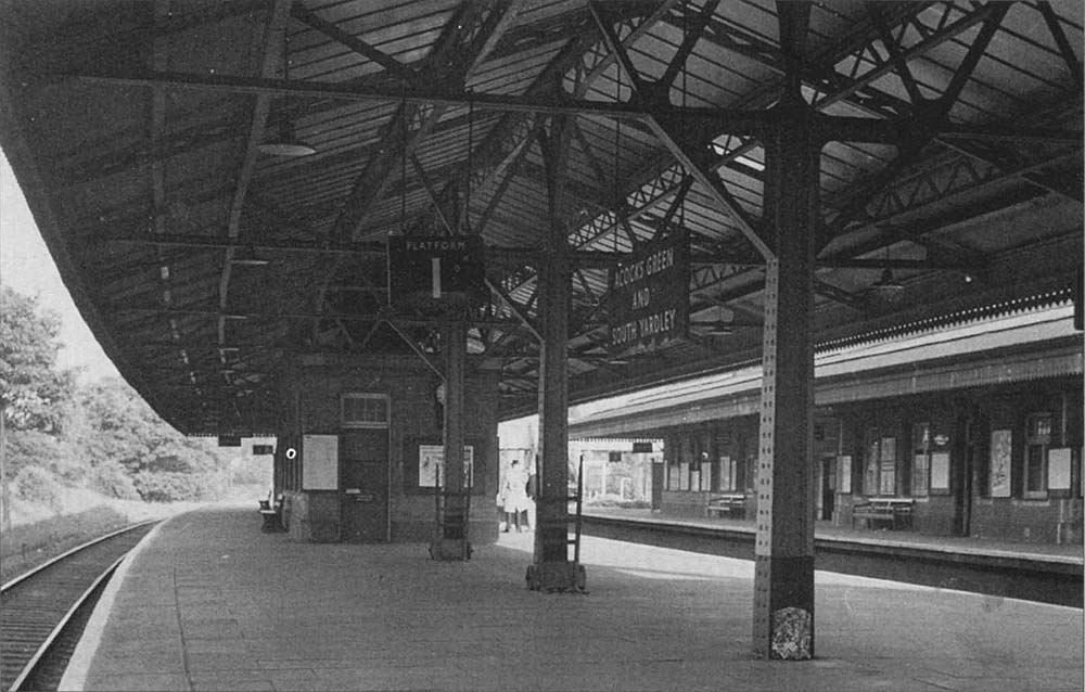 Looking along Acocks Green station's island Platform 1 from beneath the canopy sometime during the late 1950s early 1960s