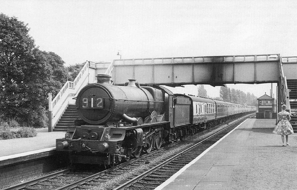 Ex-GWR 4-6-0 60xx Class No 6011 'King James I' passes through the station on 25th July 1959 with the 11:10am Paddington to Birkenhead service