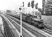 Ex-GWR 4-6-0 4073 Class No 5033 'Broughton Castle' passes south with the diverted Pines Express on 10th September 1962