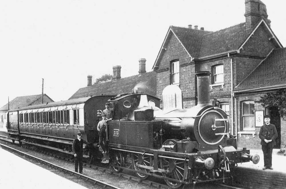 GWR 517 class, 0-4-2T No.203, with a non-corridor, eight compartment bogie brake coach and a four wheel passenger brake van