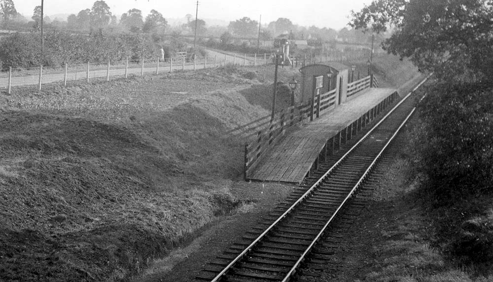View of the single line halt showing the 200 ft long by 8 ft wide wooden platform and small corrugated iron shelter