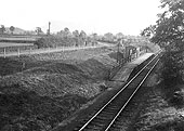 View of the single line halt showing the 200 ft long by 8 ft wide wooden platform and small corrugated iron shelter