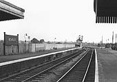 Looking along the rebuilt station's up platform towards a deserted goods yard and Bearley Junction in 1959