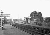 Close up showing beyond the platforms is the girder bridge carrying the railway over the main Birmingham to Stratford road