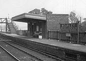 Close up showing the station's rebuilt 1939 down platform building with its extended canopy and new footbridge