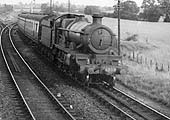 GWR 4-6-0 No 4058 'Princess Augusta' is seen on an up express servbice passing Bearley North Junction Signal Box