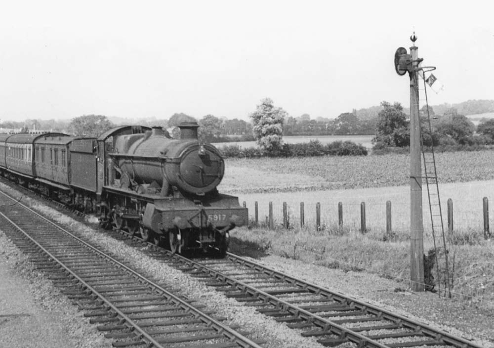 GWR 4-6-0 No 5917 'Westminster Hall' is seen on a Leamington to Stratford upon Avon local approaching Bearley West Junction