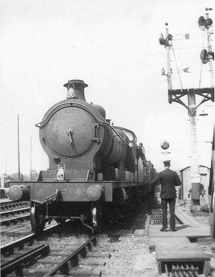 Ex-ROD 2-8-0 No 3048 is about to surrender the single line staff for the Hatton  Claverdon - Bearley section