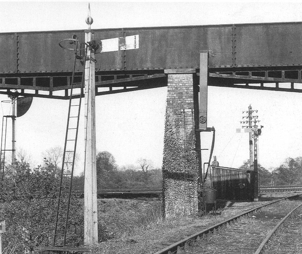 A 1953 view showing the boxed pipe from the aqueduct now being protected by a 'fire devil' against freezing weather