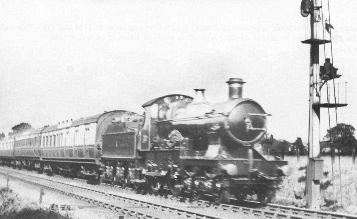 Great Western Railway ‘Flower’ class 4-4-0 No 4105 ‘Camellia’ with an express headcode speeds past the up distant signal at Bentley Heath