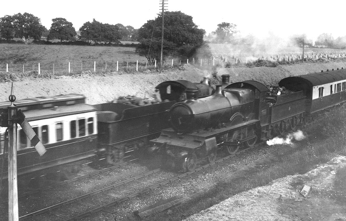 Two Great Western Railway 4-4-0 County class locomotives are seen crossing at Bentley Heath in August 1931