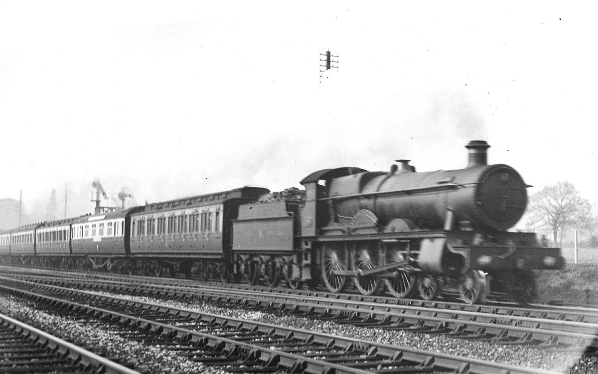 Great Western Railway 4-6-0 29xx or 'Saint' class No 2903 'Lady of Lyons' on an Up express about to cross Bentley Heath Level Crossing