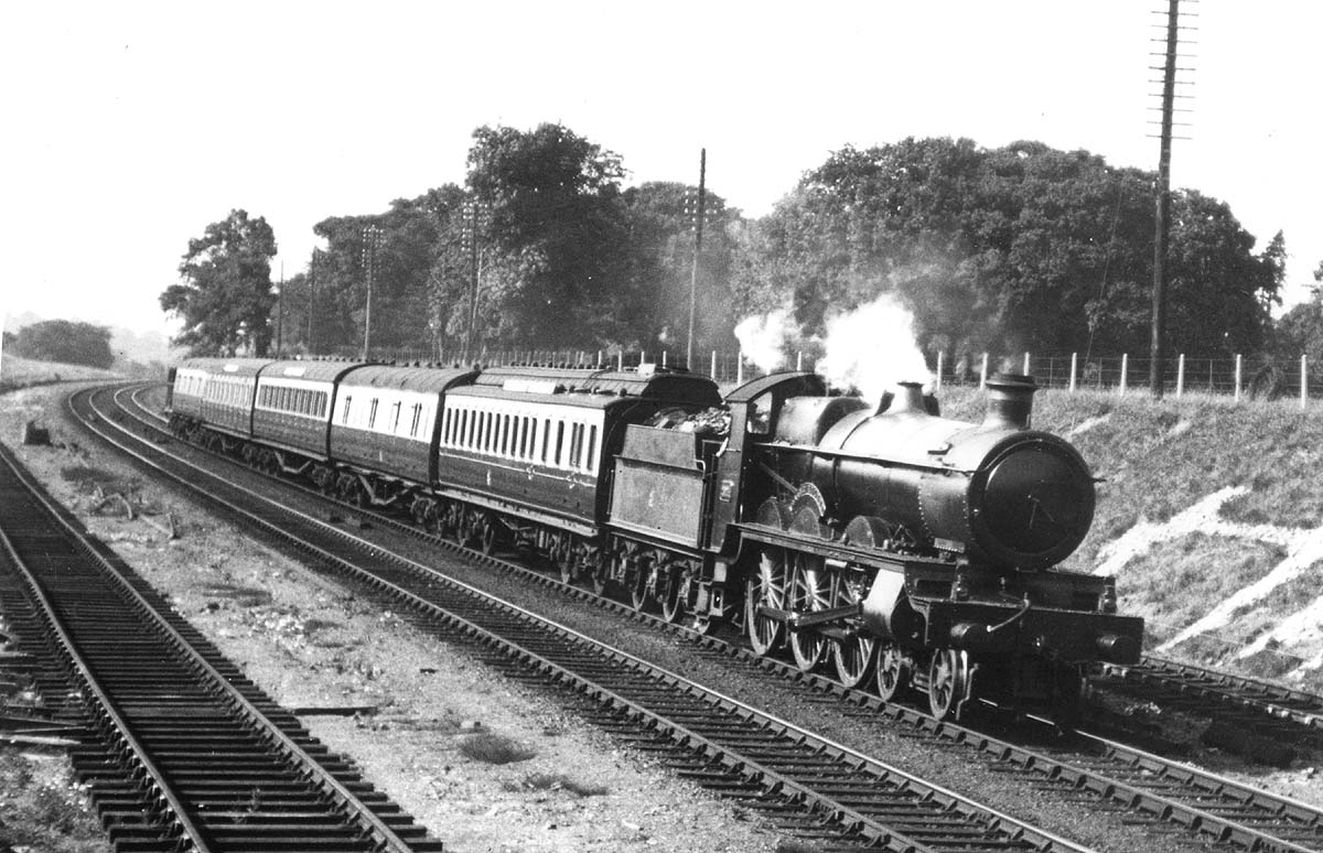 Great Western Railway 4-6-0 29xx or ‘Saint’ class No 2949 ‘Stanford Court’ on an Up express passing Bentley Heath Level Crossing
