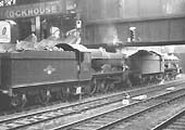 A pair of ex-GWR 4-6-0 Castle class locomotives, No 5040 'Stokesay Castle and No 5049 'Earl of Plymouth' are seen standing under the footbridge