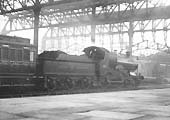 GWR 4-4-0 Badmington class No 3294 'Blenheim' is seen at the head of a down express at Platform 6 during the rebuilding of Snow Hill station
