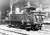 GWR 0-4-2T No 517, the founding member of the class, is seen standing bunker first on the uo middle through road at the South end of Snow Hill station