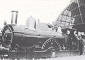 GWR 2-2-2 'Queen' class No 1132 'Prince of Wales' stands at the North end of Snow Hill station's down platform at the head of an express