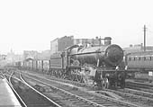 GWR 4-6-0 Hall class No 4917 'Crosswood Hall' is seen at the head of an up freight from Hockley as it passes through Snow Hill on the up through road
