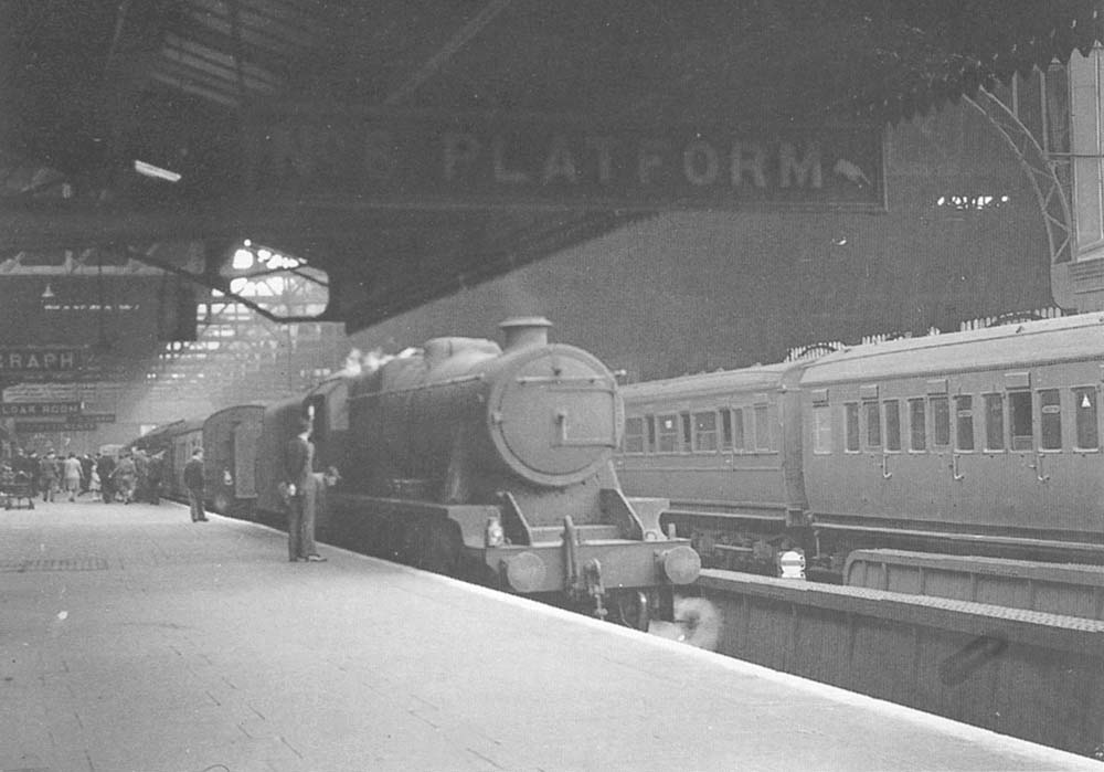 Stanier 2-8-0 No 8400 is seen standing light engine after piloting from Leamington a failed Hall class locomotive on the 7 10am express from Paddington