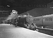 Stanier 2-8-0 No 8400 is seen standing light engine after piloting from Leamington a failed Hall class locomotive on the 7 10am express from Paddington