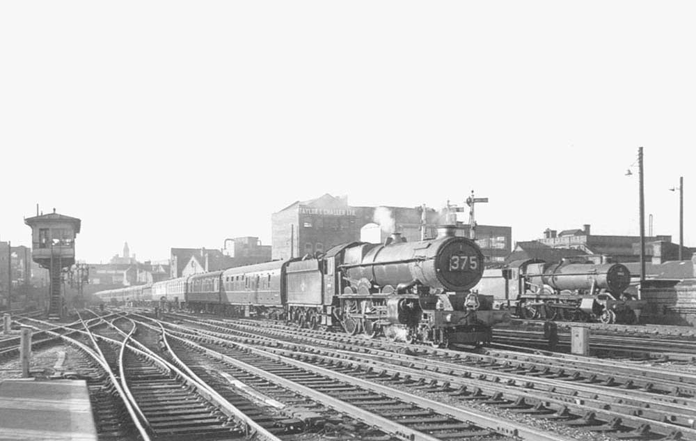 Ex-GWR 4-6-0 King class No 6000 'King George V, the first in a class of 30 locomotives, is seen approaching Snow Hill on an up Class A express passenger service