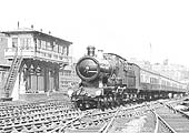 Ex-GWR 4-4-0 City class No 3440 'City of Truro' is seen at the head of an up enthusiasts special as it passes Snow Hill's North Signal Box