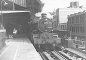 Ex-GWR 4-6-0 Castle class No 5076 'Gladiator'' is seen standing at Platform 2 whilst at the head of a down Class B local passenger service