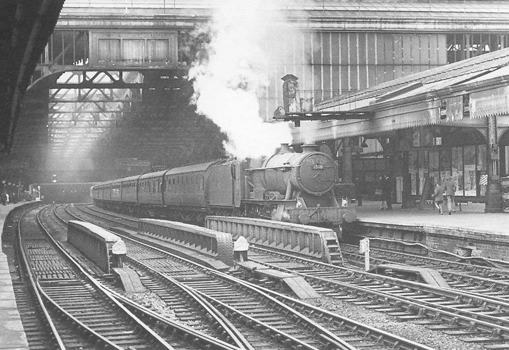 Ex-GWR 4-6-0 County class No 1010 'County of Caernarvon' is seen standing at Platform 5 the head of a down Class A express service on 10th August 1963