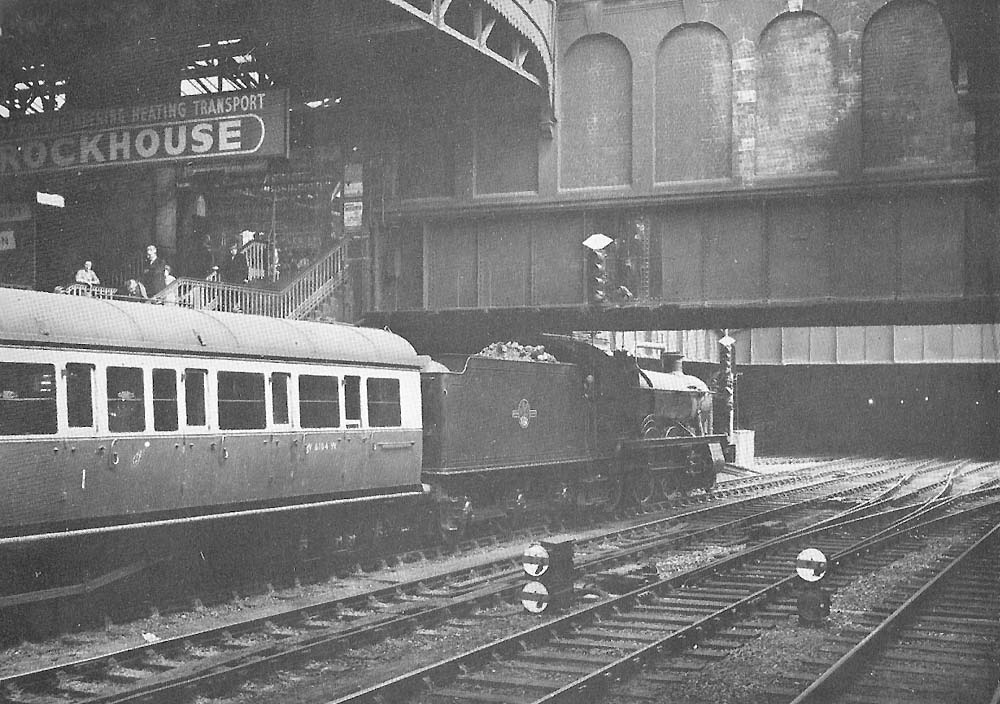 An ex-Great Western 4-6-0 49XX 'Hall' class locomotive No 5955 'Garth Hall' standing at the end of platform 7 with the 3 45 Swansea train in June 1957