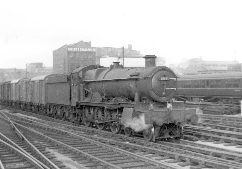 Ex-GWR 4-6-0 Grange class No 6841 'Marlas Grange' is seen entering Snow Hill at the head of an up Class C vacuum fitted express freight service