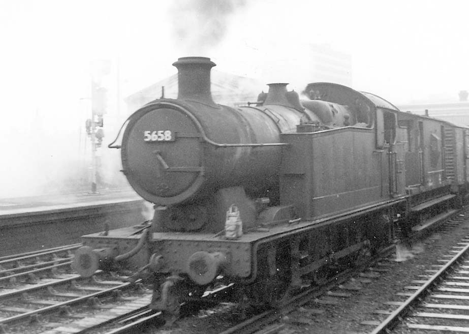 Ex-GWR 0-6-2T 56xx class No 5658 is seen on the down through road whilst at the head of a Class K short freight trip working from Bordesley to Hockley goods yard