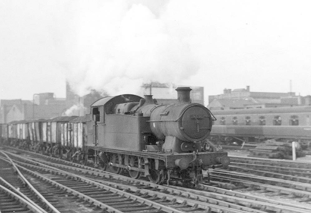 Ex-GWR 0-6-2T 56xx class No 5606 is seen working hard as it approaches Snow Hill station on the up through road whilst at the head of a Class E mineral train