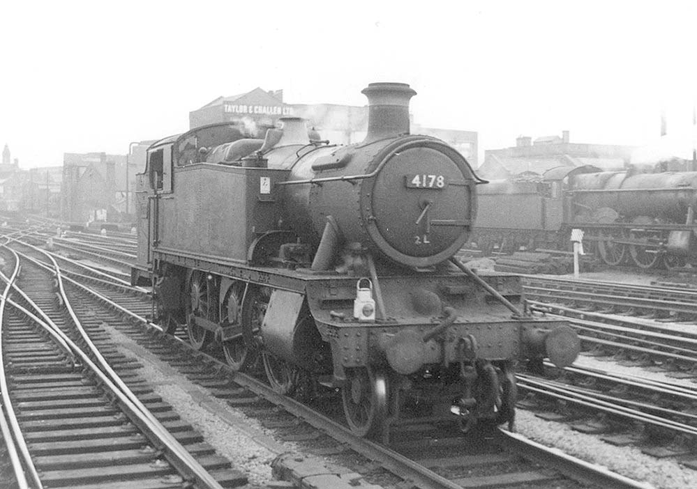 British Railways built Large Prairie No 4178 is seen running bunker first on the down through road to Hockley to take forward a Class J empty mineral wagon working