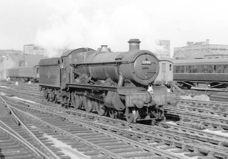 Ex-GWR 4-6-0 Hall class No 5990 'Dorford Hall' is seen running light engine through Snow Hill's up through road to Tyseley shed to be serviced with coaling and water