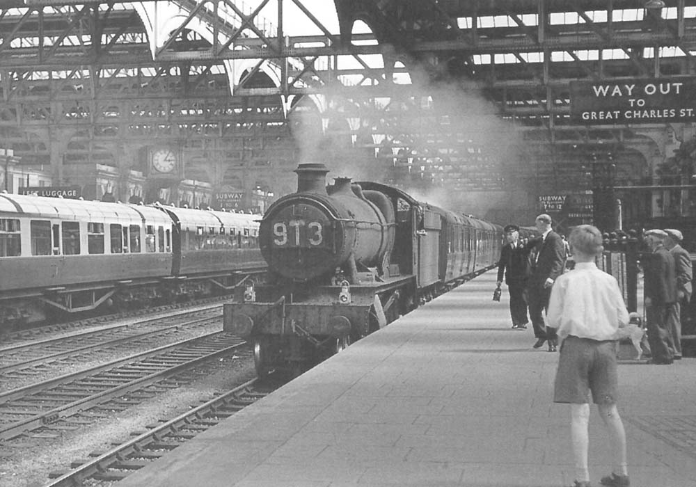 Ex-GWR 4-6-0 Hall class No 4925 'Eynsham Hall' is seen arriving at Platform 6 at the head of the 9 30am Bournemouth (West) to Birkenhead (Woodside) express service