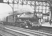 Ex-GWR 4-6-0 King class No 6017 'King Edward IV' is seen entering Platform 7 whilst at the head of an up express service to Paddington