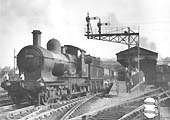 Ex-GWR 4-4-0 Dukedog class No 9001 is seen passing through Snow Hill on an engineering train of hopper wagons on 13th September 1953